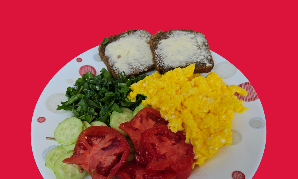 Home A plate of scrambled eggs and veggies