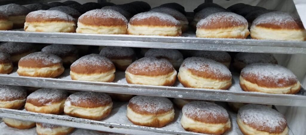 Pączki Day: Why does everyone love the Polish doughnut? Shelves of powdered pączki